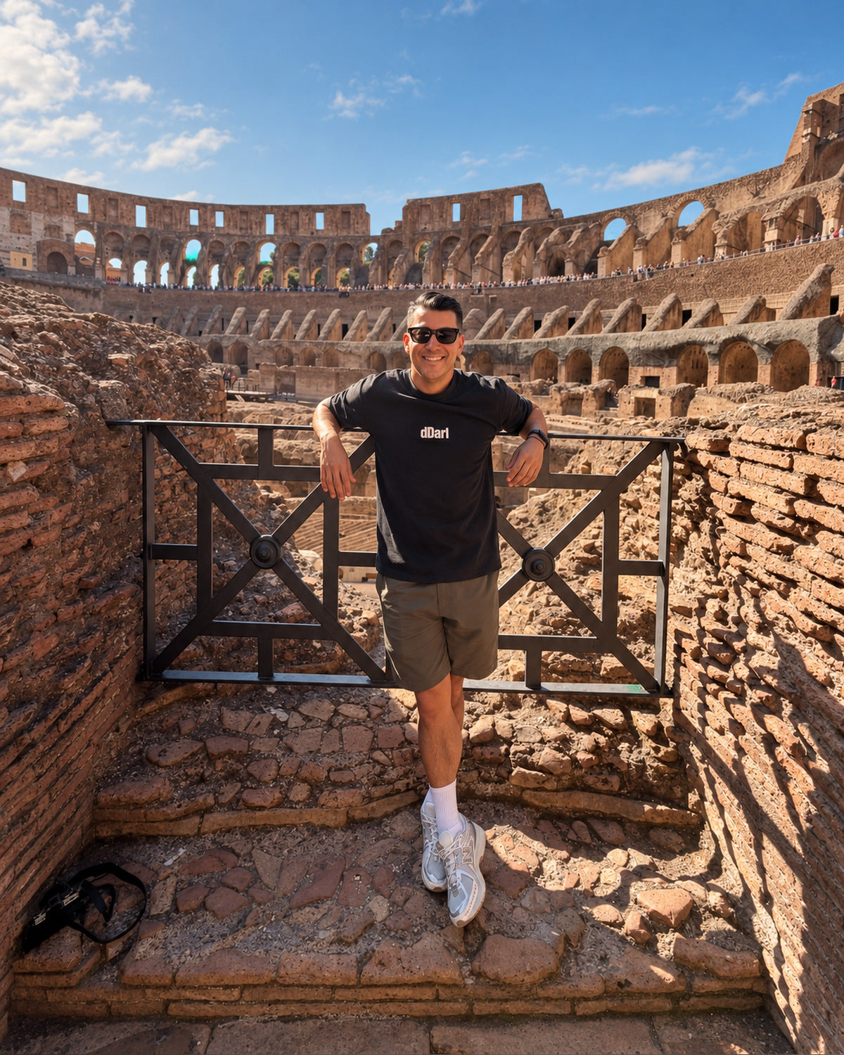 dDARL Puff Tee in Black, worn by a man at the Colosseum in Rome