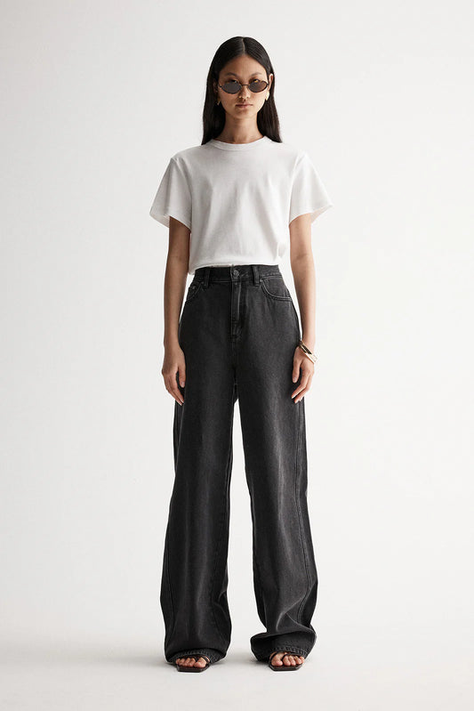 Elka Collective Apollo Wide Leg Jean in Washed Black — the Elka Collective Apollo Wide Leg Jean in Washed Black features a mid-rise fit with a full-length wide leg, creating an effortless, relaxed silhouette.