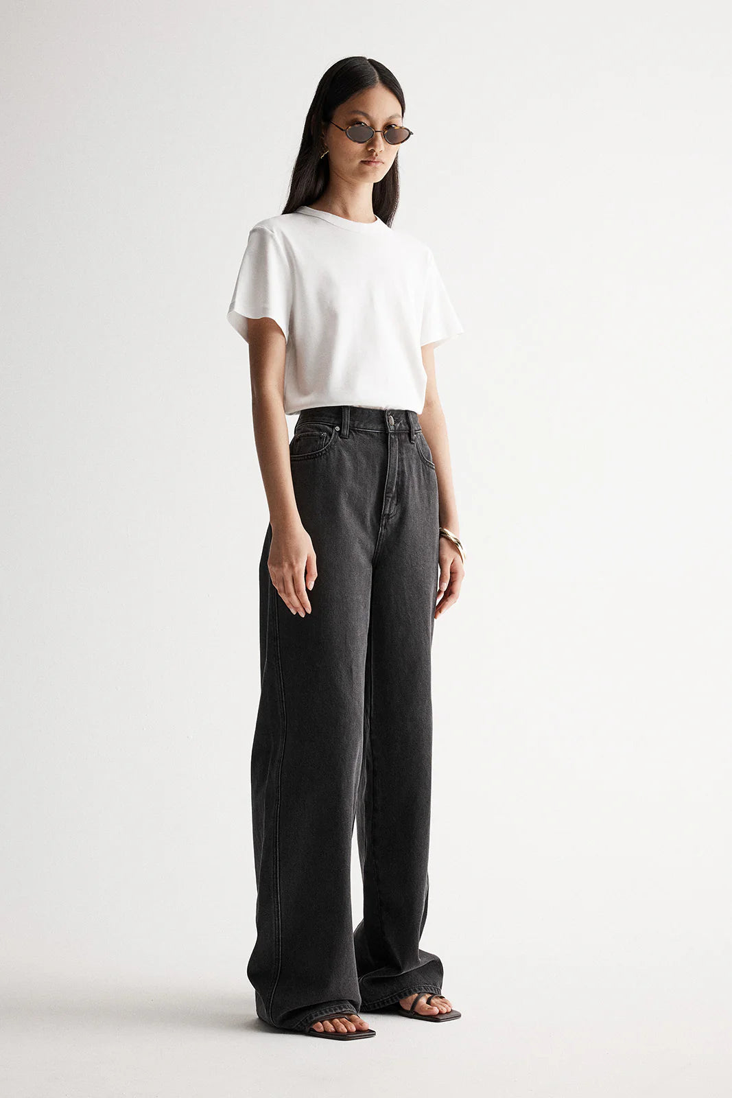 Elka Collective Apollo Wide Leg Jean in Washed Black — the Elka Collective Apollo Wide Leg Jean in Washed Black features a mid-rise fit with a full-length wide leg, creating an effortless, relaxed silhouette.