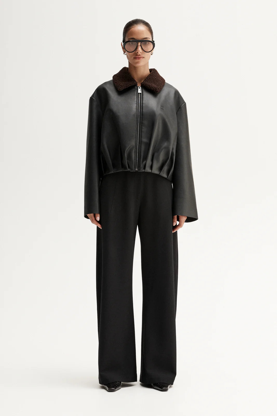 Elka Collective Archer Jacket in Black — a sharp iteration of a utilitarian classic, the Elka Collective Archer Jacket in Black is a definitive outer layer for the modern wardrobe.