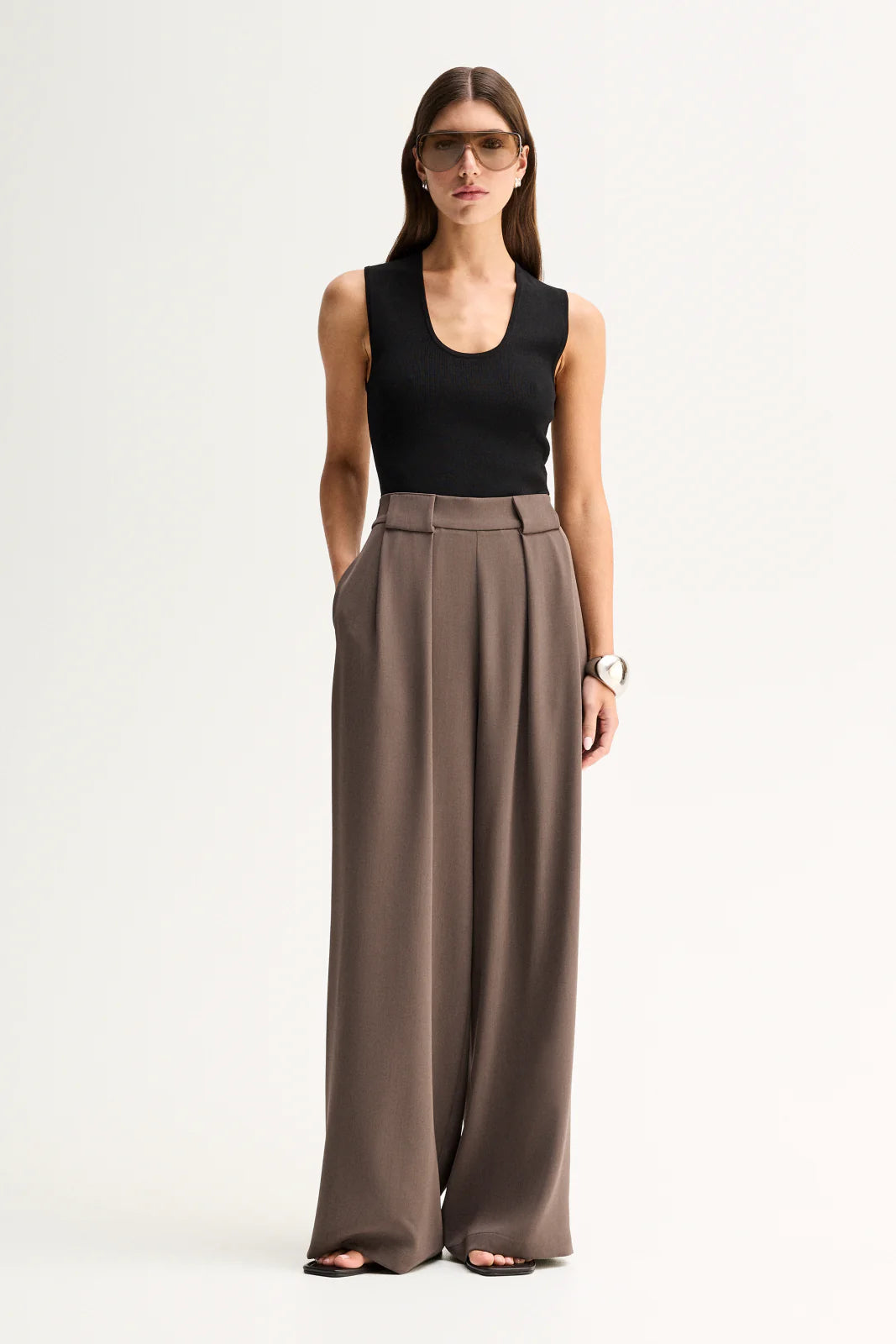 Elka Collective Fleur Pants in Taupe, full-length front view on model.
