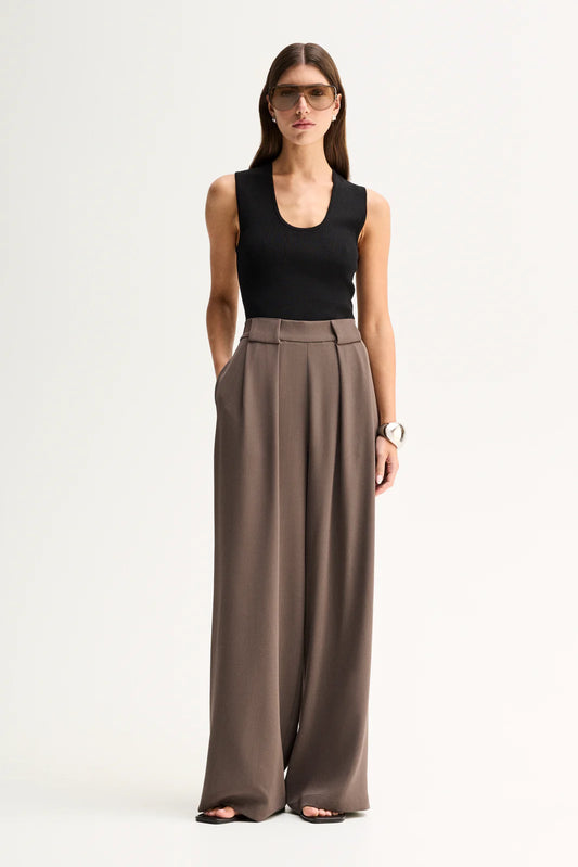 Elka Collective Fleur Pants in Taupe, full-length front view on model.
