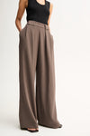 Elka Collective Fleur Pants in Taupe, waistband and wide-leg detail.

