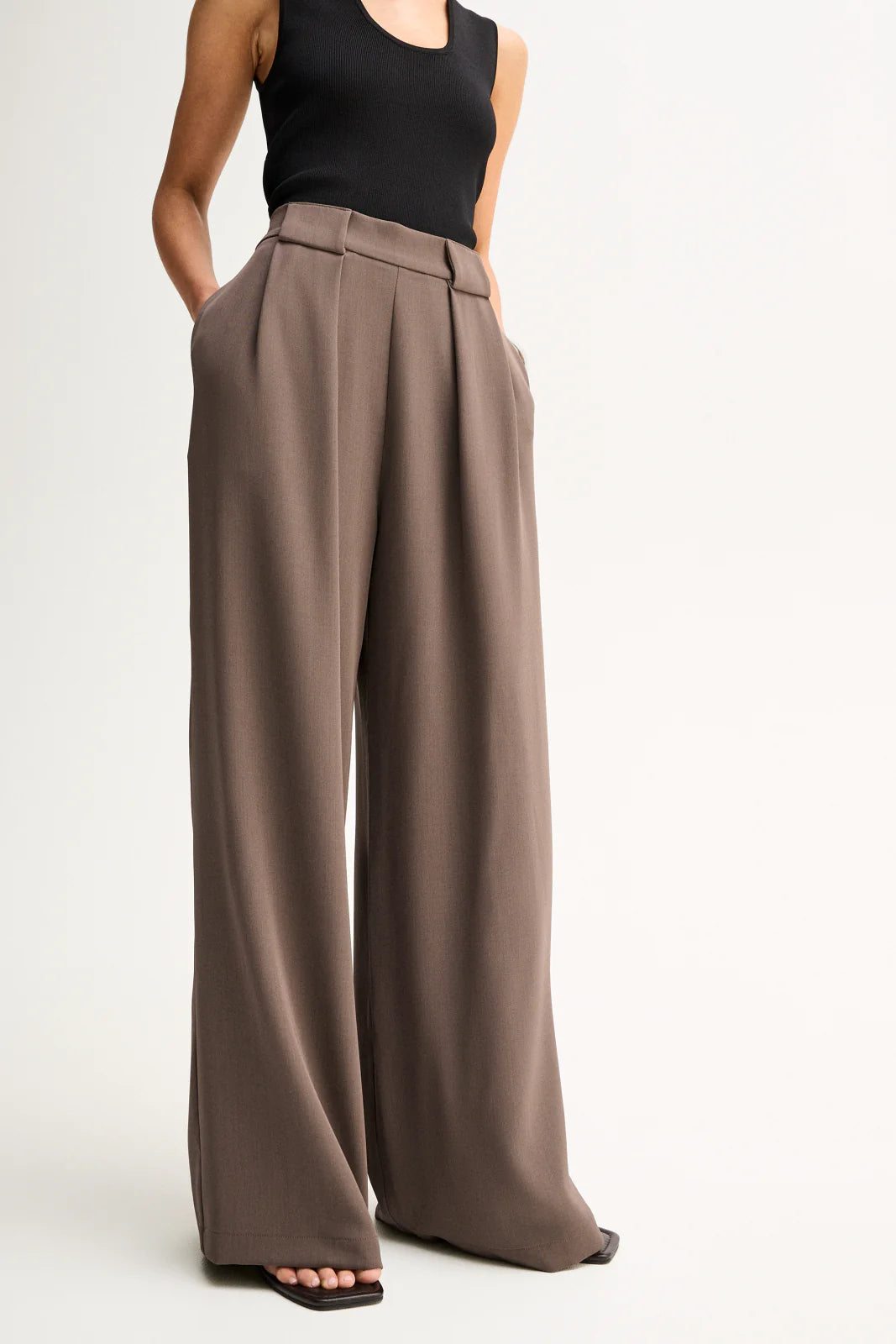 Elka Collective Fleur Pants in Taupe, waistband and wide-leg detail.
