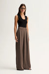 Elka Collective Fleur Pants in Taupe, angled full-length front view.
