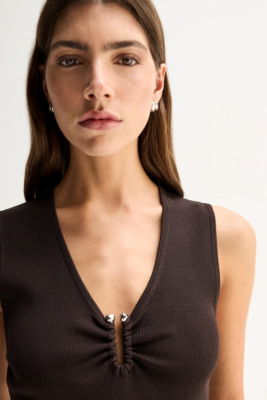 Elka Collective Lindsay Knit Top in Chocolate, close-up showing the V-neckline and gathered hardware detail.
