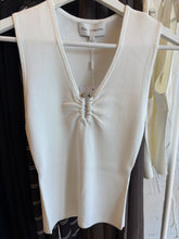 Elka Collective Lindsay Knit Top in White, front product view on hanger.

