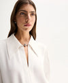 Elka Collective Millicent Shirt in Ivory — meet the shirt that trades basic for statement.
