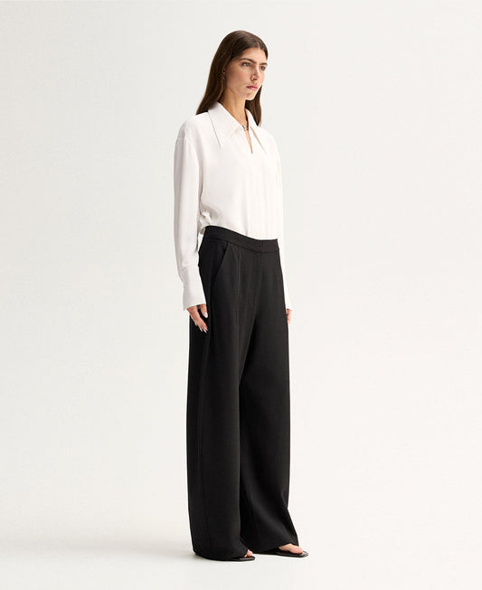 Elka Collective Millicent Shirt in Ivory — meet the shirt that trades basic for statement.