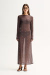 A woman wearing a slate sheer maxi dress with long sleeves, scattered stud details and a crew neckline in a full-length front view.