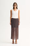 A woman wearing a slate sheer midi skirt with all-over stud details, an elasticated waist and a white sleeveless top in a full-length front view.