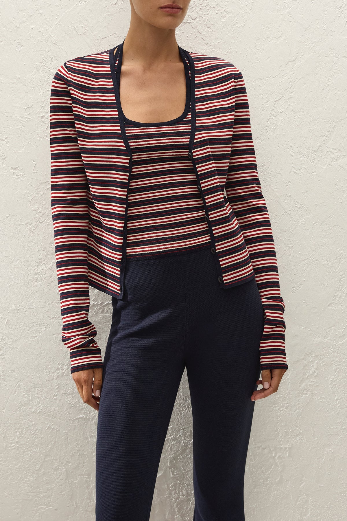 Faithfull The Brand Doris Cardigan in Cila Stripe Navy, close-up layered styling on model.