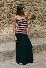 Faithfull The Brand Doris Maxi Dress in Cila Stripe Navy worn outdoors against a stone wall.
