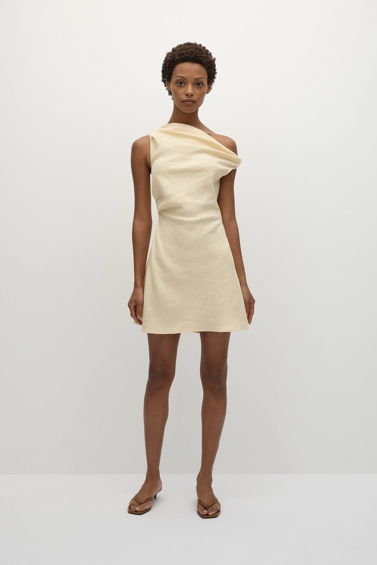 Faithfull The Brand Suis Mini Dress — a summer-inspired mini dress, designed from a signature 100% European Flax® linen fabrication in a buttery yellow.