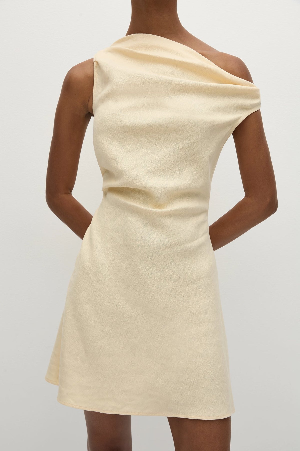 Faithfull The Brand Suis Mini Dress — a summer-inspired mini dress, designed from a signature 100% European Flax® linen fabrication in a buttery yellow.