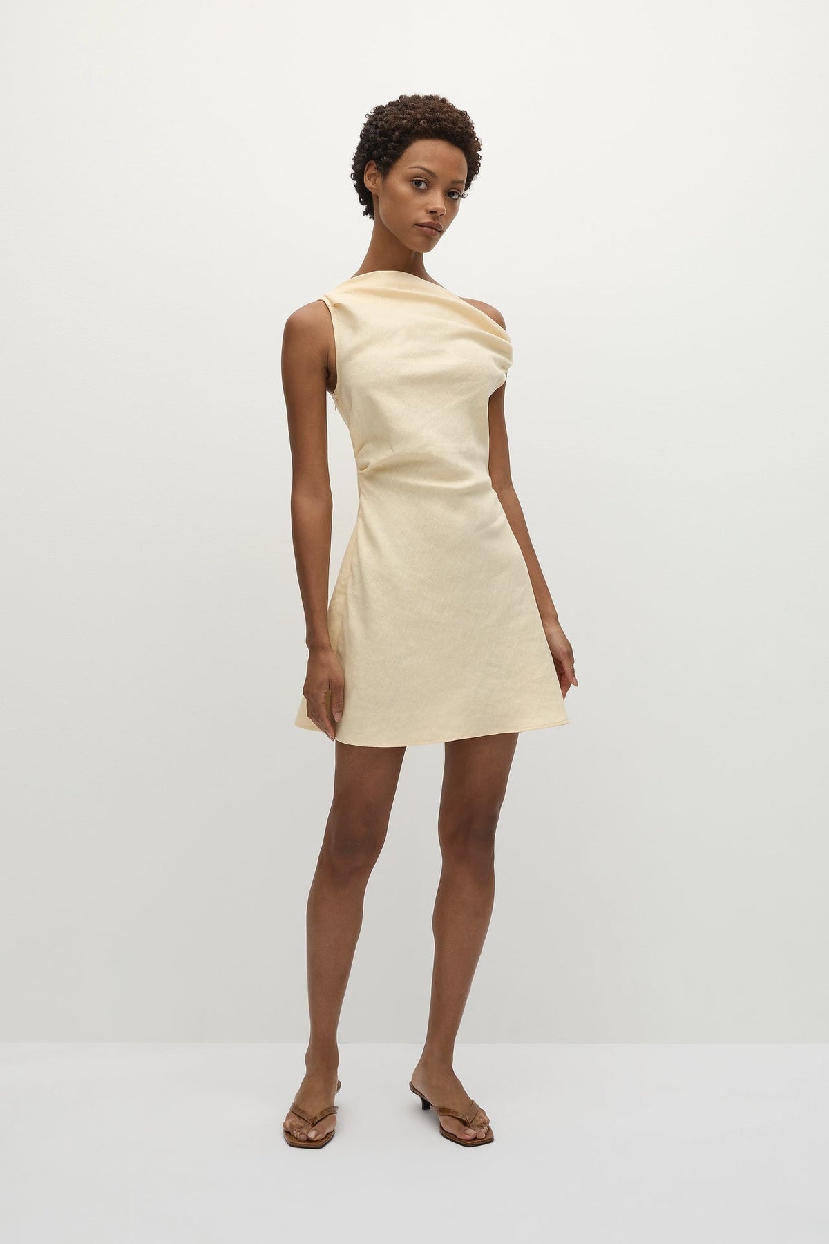 Faithfull The Brand Suis Mini Dress — a summer-inspired mini dress, designed from a signature 100% European Flax® linen fabrication in a buttery yellow.