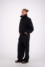 Jasmine Alexa Bailey Bomber Jacket in Black, angled full-length side view with collar raised.
