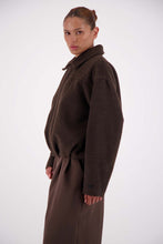 Jasmine Alexa Bailey Bomber Jacket in Brown, cropped side view showing the relaxed silhouette.

