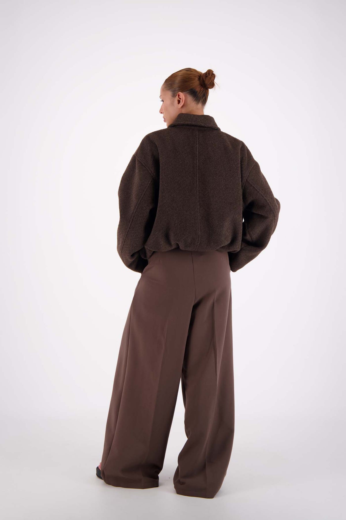 Jasmine Alexa Bailey Bomber Jacket in Brown, full-length back view on model.
