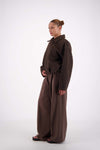 Jasmine Alexa Bailey Bomber Jacket in Brown, angled full-length side view on model.