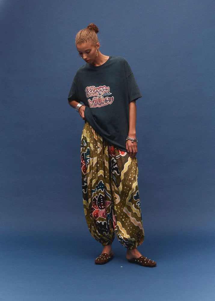 Kinga Csilla Avviso Lotus Og Tee — bring a playful graphic energy and a worn-in feel to your everyday rotation.