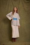 Model wearing the grey marl Inner Peace graphic tee layered over cream lace sleeves with a matching lace maxi skirt and brown boots in a full-length front view.