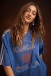 Kinga Csilla Sunset Tee in Blue — the Sunset Tee returns to inject some serious dopamine into your everyday wardrobe.