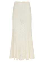 Cream lace maxi skirt shown on its own, showing the fitted waistband, long flowing silhouette, intricate lace texture and softly flared hem.