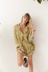 Front angled view of the Dorato printed button-up shirt styled with matching ruffle shorts and silver jewellery against a clean white backdrop.