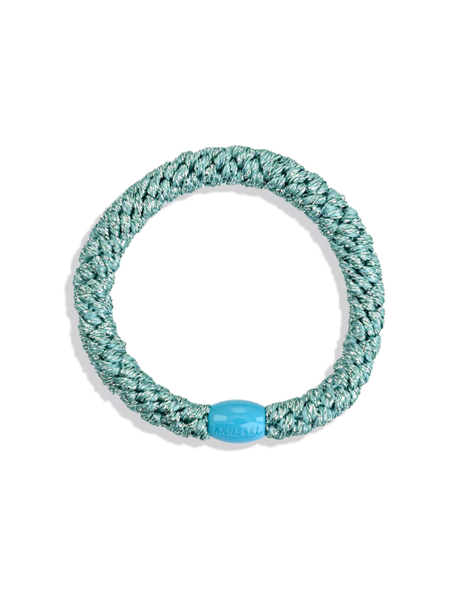 Green and silver glitter woven hair tie with a turquoise branded bead shown individually against a clean background.