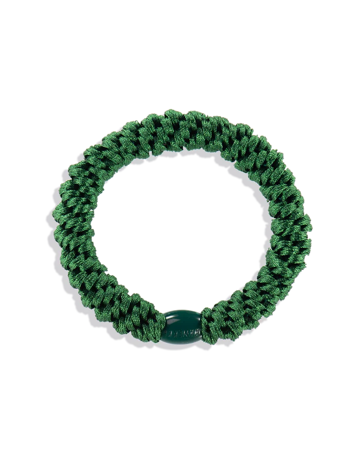 Forrest Green woven hair tie shown in a circular product view with a matching dark green branded bead.