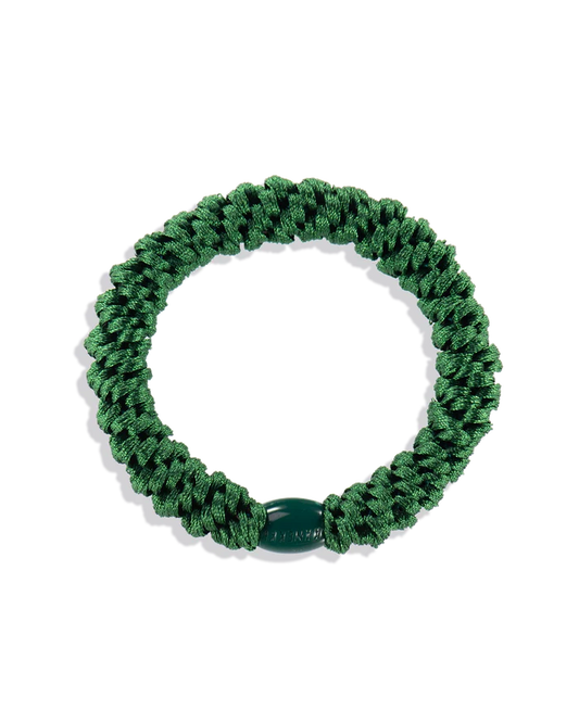 Forrest Green woven hair tie shown in a circular product view with a matching dark green branded bead.