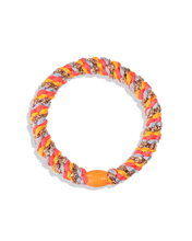 Multicoloured woven hair tie in rose, baby blue, orange and glitter tones shown against a plain background.