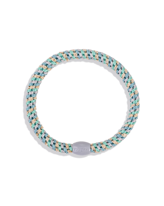 Slim mixed teal and gold glitter woven hair tie with a light bead shown in a circular product view.