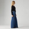 Model wearing the Levi's 318 Shaping Wide Leg Jeans in the Clever Girl wash, showing the high-rise fit and flared wide-leg silhouette in a side view.