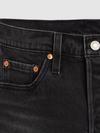 Close-up of black denim shorts showing the waistband, belt loop, metal button and copper-tone rivets.