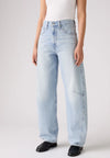 Close-up front view of the light-wash jeans showing the high-rise waistband, button closure, front pockets and curved leg seams.