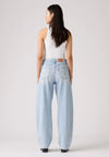 Back view of the light-wash jeans showing the back pockets, waistband patch and relaxed leg shape.