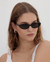 Lu Goldie Alexe in Black — she’s an uptown girl, and as usual, she’s late.