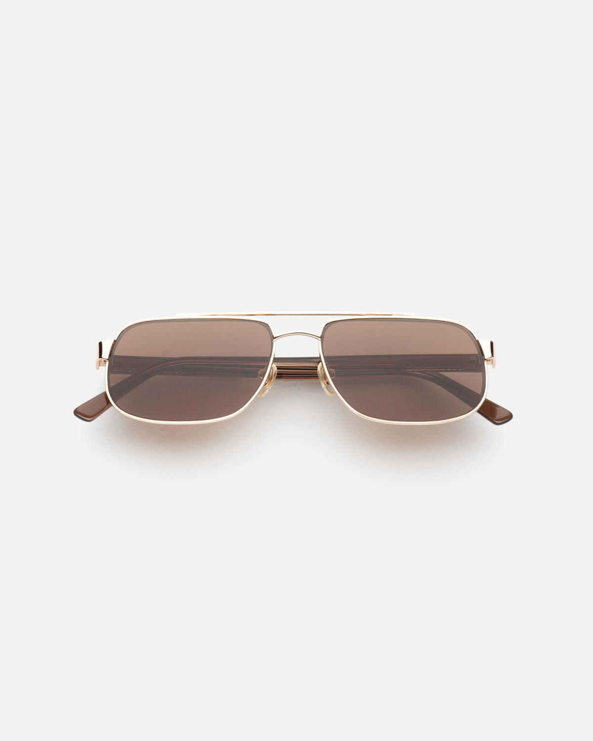 Lu Goldie Evangeline Sunglasses in Coffee — a hot girl take on the classic aviator, she brings an air of authority to any outfit.