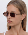 Lu Goldie Evangeline Sunglasses in Coffee — a hot girl take on the classic aviator, she brings an air of authority to any outfit.
