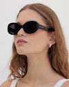 Lu Goldie Valentina in Black — they’re giving old money, mob wife, 60s superstar paparazzi’d descending from her private jet.