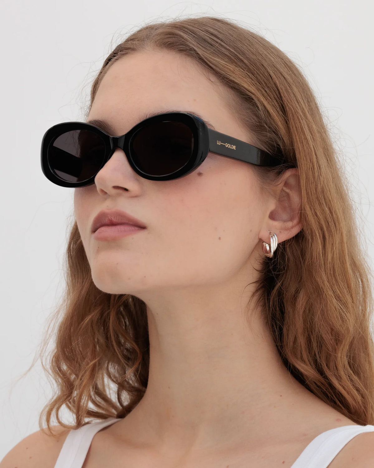 Lu Goldie Valentina in Black — they’re giving old money, mob wife, 60s superstar paparazzi’d descending from her private jet.