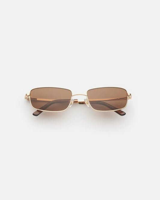 Lu Goldie Yuki Sunglasses in Coffee — she can pull off any look— hyper feminine, iconic 90s or futuristic cyber punk.