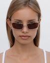Lu Goldie Yuki Sunglasses in Coffee — she can pull off any look— hyper feminine, iconic 90s or futuristic cyber punk.