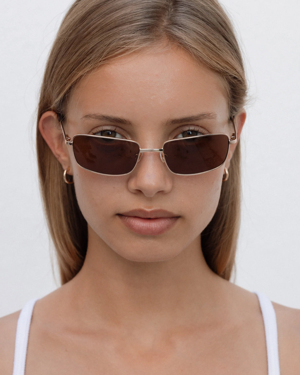 Lu Goldie Yuki Sunglasses in Coffee — she can pull off any look— hyper feminine, iconic 90s or futuristic cyber punk.