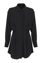 A black collared mini dress is displayed from the front, showing long sleeves, a concealed fastening and a pleated waist.