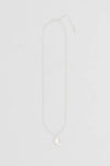 Nina Gordon Drop Necklace — a weighty drop pendant suspended from an adjustable fine chain, offering a modern style for effortless wear.