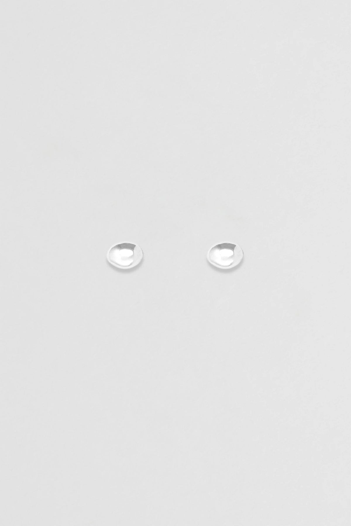 Nina Gordon Figure Studs — sculpted dome studs, designed for ease and daily wear.