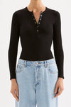 Nude Lucy Binx Long Sleeve in Black — a refined everyday essential with a close, figure-hugging silhouette, the Nude Lucy Binx Long Sleeve in Black is designed with a crew neckline and fitted long sleeves.